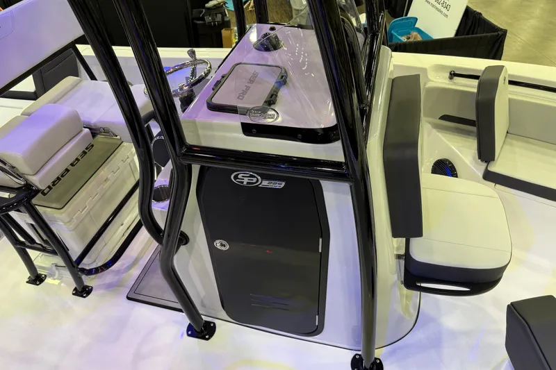 Slide: The Image of 2025 Sea Pro 225FLX Sandbar boat interior with seating and console details. - 23