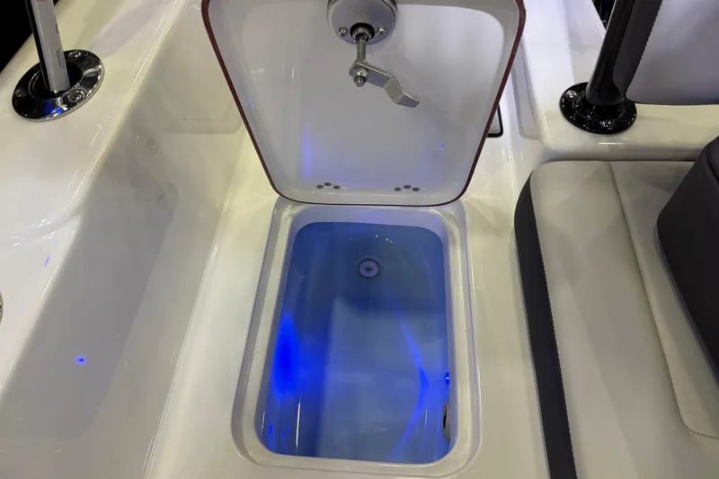 Slide: The Image of Livewell with blue lighting on 2025 Sea Pro 225FLX Sandbar boat. - 28
