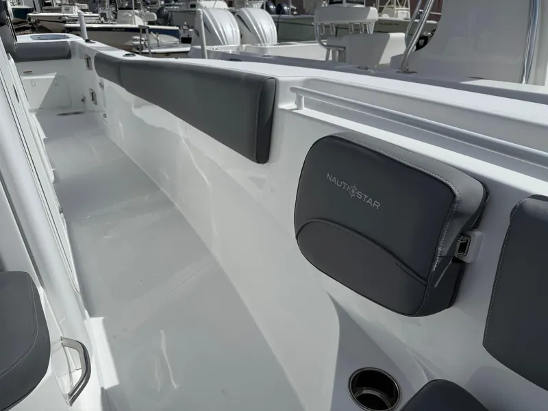 Slide: The Image of 2025 NauticStar 292 Legacy boat interior with sleek seating and modern design. - 20