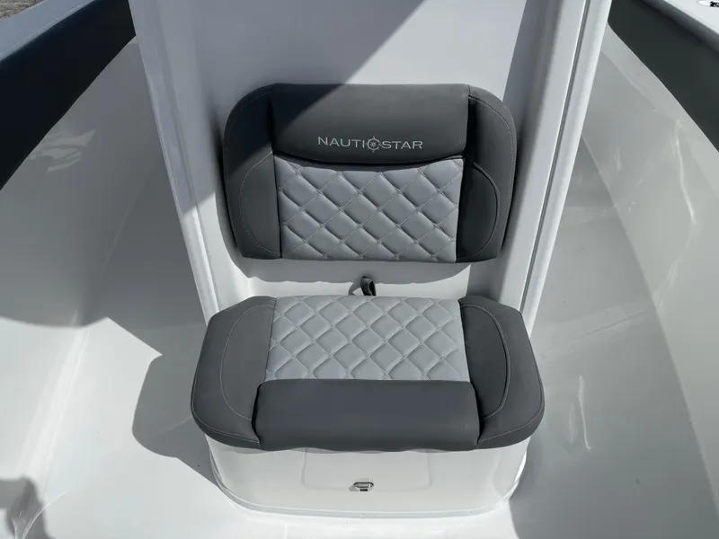 Slide: The Image of 2025 NauticStar 292 Legacy boat seat with quilted gray upholstery. - 21