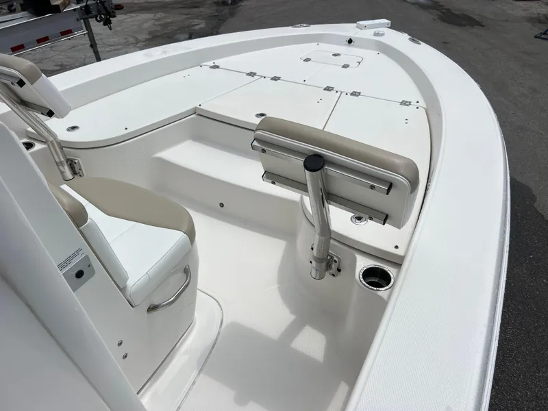 Slide: The Image of 2018 Robalo 226 Cayman boat interior with seating and storage compartments. - 11