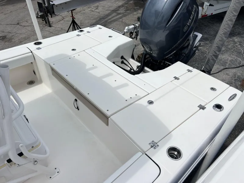 Slide: The Image of 2018 Robalo 226 Cayman boat with Yamaha outboard motor, featuring spacious deck layout. - 14