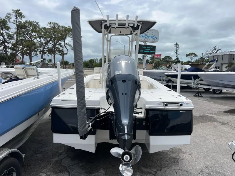 Slide: The Image of 2018 Robalo 226 Cayman boat with outboard motor, parked in a marina. - 5