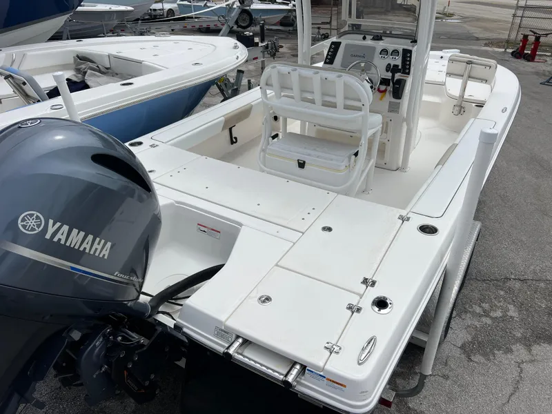 Slide: The Image of 2018 Robalo 226 Cayman boat with Yamaha engine, featuring spacious deck and helm controls. - 6