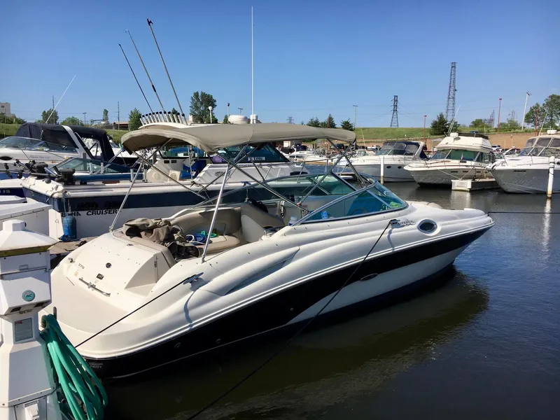 Slide: The Image of 2002 Sea Ray 270 Sundeck boat docked in marina under clear blue sky. - 20