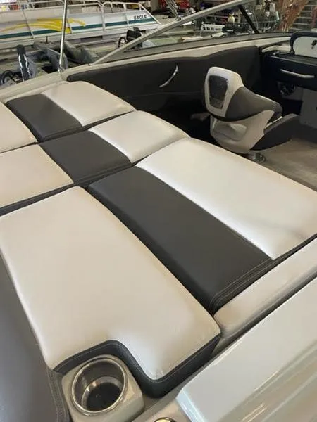 Slide: The Image of 2023 Crownline 200 SS boat interior with sleek seating and modern design. - 4