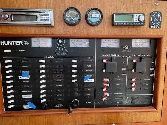 Slide: The Image of Electrical control panel of a 1999 Hunter 380 sailboat with gauges and switches. - 18