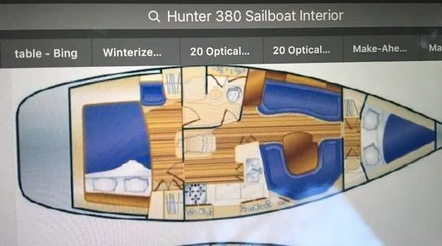 Slide: The Image of Interior layout of a 1999 Hunter 380 sailboat, featuring cabins and living areas. - 30