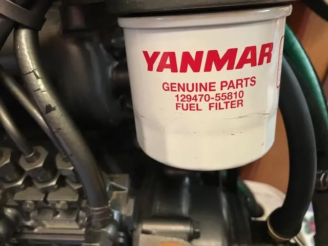 Slide: The Image of Yanmar fuel filter on a 1999 Hunter 380 engine, part number 129470-55810. - 33