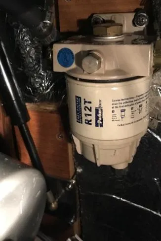 Slide: The Image of Fuel filter system in a 1999 Hunter 380 boat engine compartment. - 37