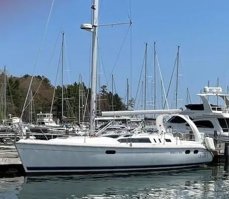 Slide: The Image of Sailboat docked in marina, Hunter 380 model, 1999, surrounded by other boats. - 4