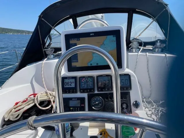 Slide: The Image of Cockpit of a 1999 Hunter 380 sailboat with navigation instruments and steering wheel. - 40