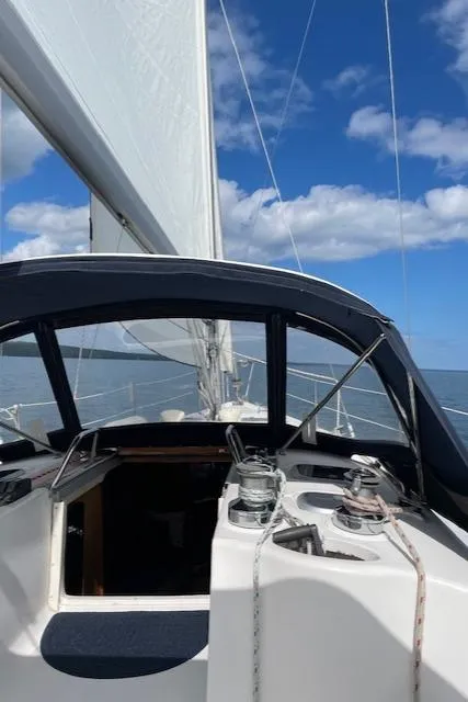 Slide: The Image of Sailing on a 1999 Hunter 380 yacht under clear blue skies. - 44