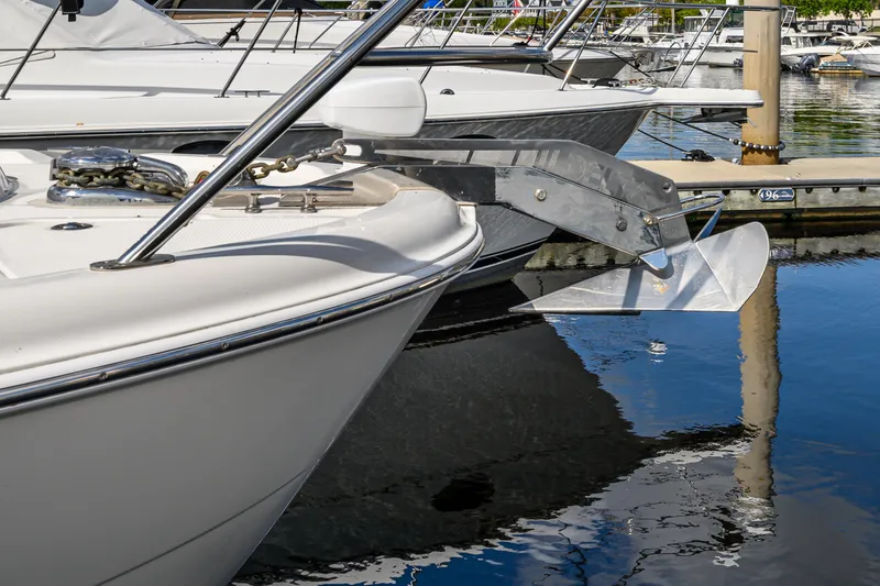 Slide: The Image of 2008 Meridian 341 Sedan yacht docked at marina, featuring sleek design and polished anchor. - 11