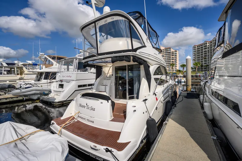 Slide: The Image of 2008 Meridian 341 Sedan yacht docked at marina under blue sky. - 12