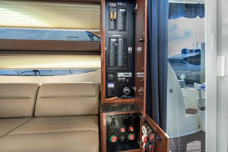 Slide: The Image of Interior of 2008 Meridian 341 Sedan yacht with control panel and beige seating. - 18