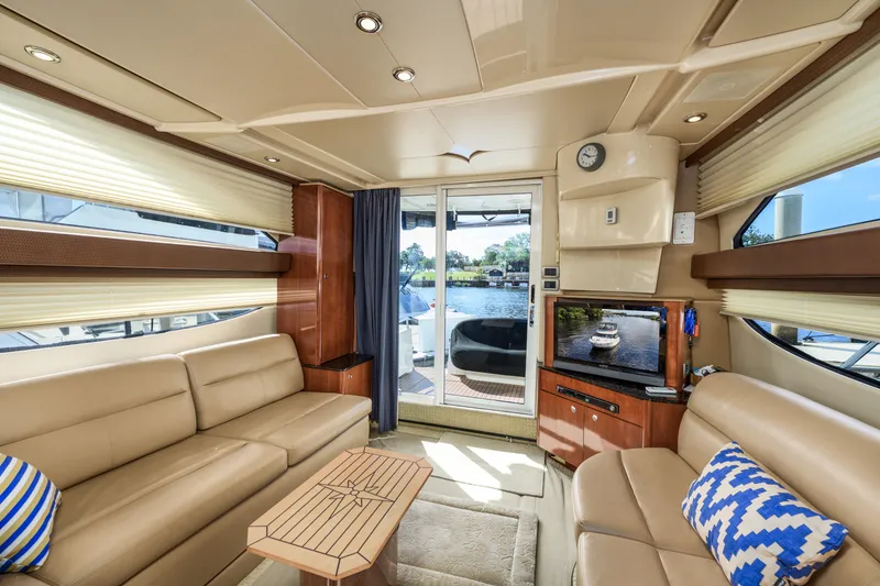 Slide: The Image of Luxurious interior of a 2008 Meridian 341 Sedan yacht with plush seating and elegant decor. - 19