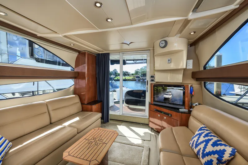 Slide: The Image of Luxurious interior of a 2008 Meridian 341 Sedan yacht with elegant seating and scenic views. - 20