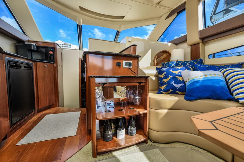 Slide: The Image of Luxurious interior of a 2008 Meridian 341 Sedan yacht with elegant seating and bar area. - 21