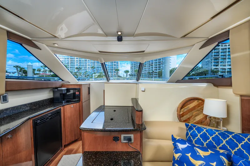 Slide: The Image of Interior of 2008 Meridian 341 Sedan yacht with modern kitchen and seating area. - 23