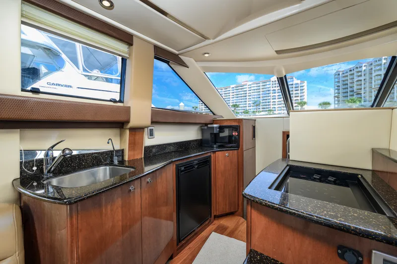 Slide: The Image of Interior of 2008 Meridian 341 Sedan yacht with modern kitchen amenities. - 24