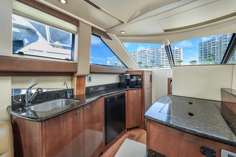 Slide: The Image of Luxurious interior of a 2008 Meridian 341 Sedan yacht with modern kitchen amenities. - 25