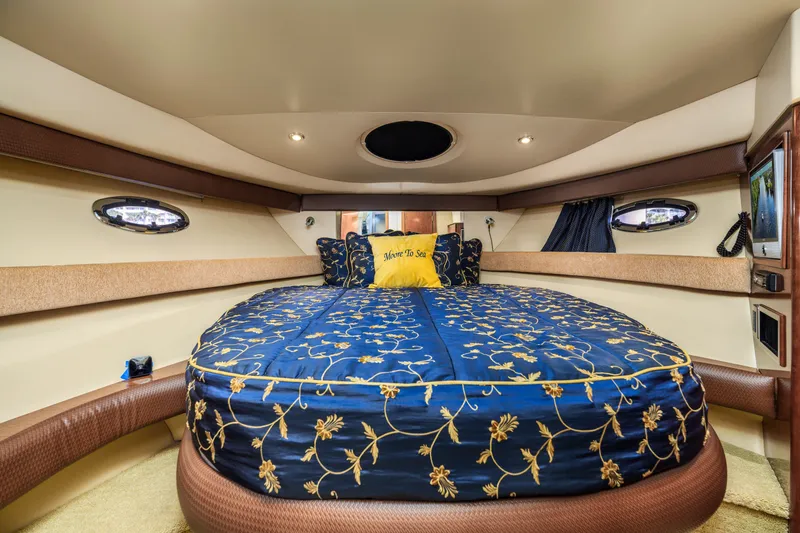 Slide: The Image of Luxurious 2008 Meridian 341 Sedan yacht bedroom with elegant blue floral bedding. - 26