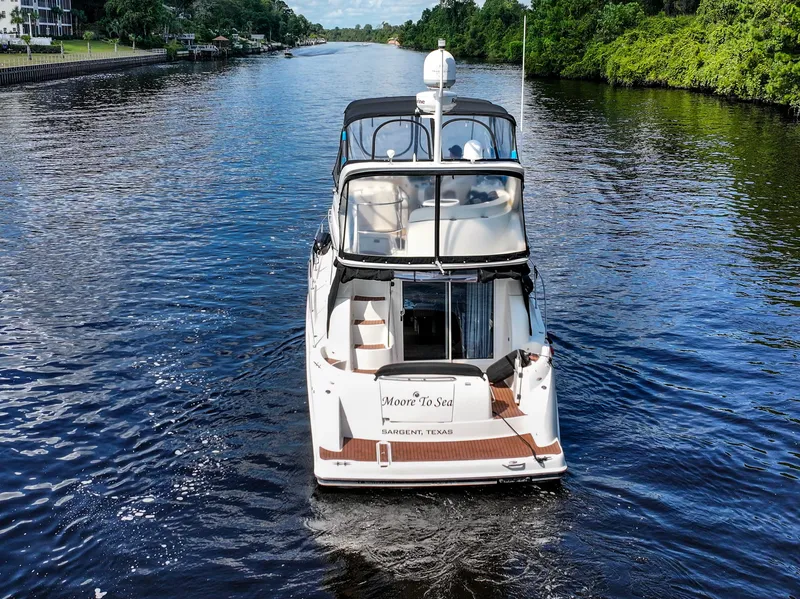 Slide: The Image of 2008 Meridian 341 Sedan cruising on a scenic river with lush greenery. - 3