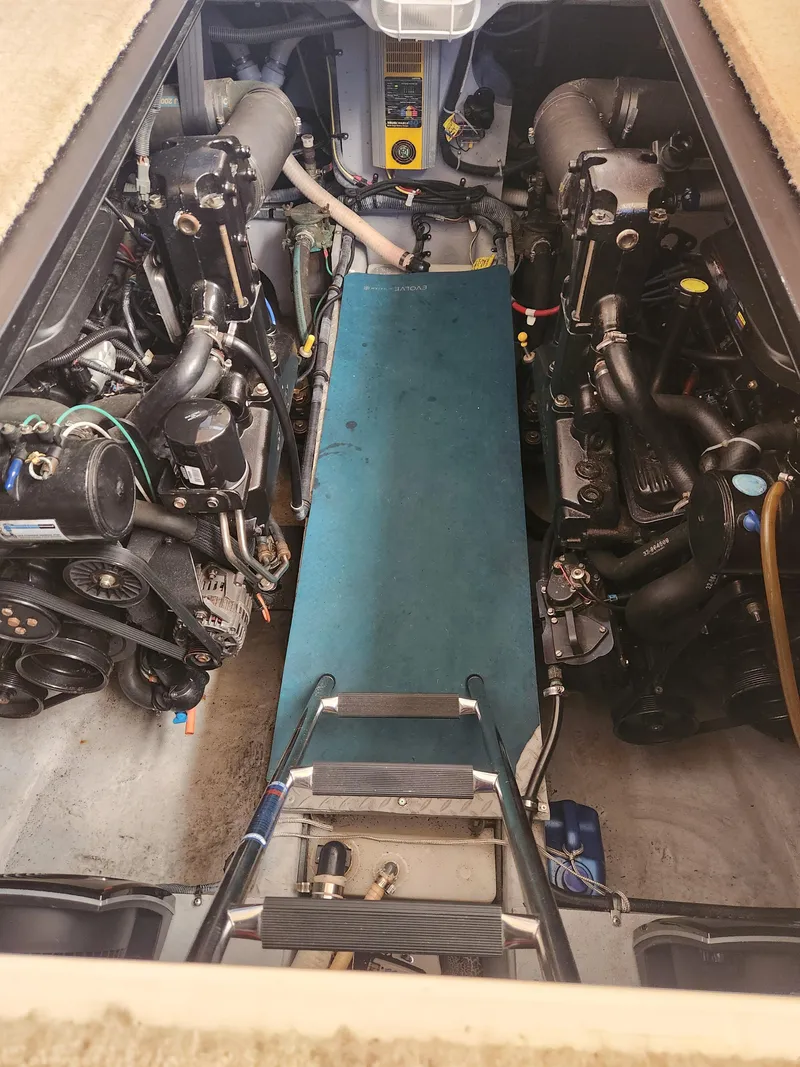 Slide: The Image of Engine compartment of a 2008 Meridian 341 Sedan boat, showcasing dual engines and mechanical components. - 31