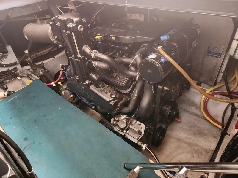 Slide: The Image of Engine compartment of a 2008 Meridian 341 Sedan boat, showcasing detailed mechanical components. - 32