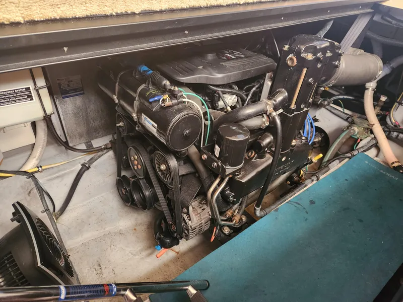 Slide: The Image of Engine compartment of a 2008 Meridian 341 Sedan boat, showcasing mechanical components. - 33