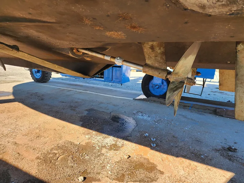 Slide: The Image of Underneath view of a 2008 Meridian 341 Sedan boat showing propeller and rudder. - 40