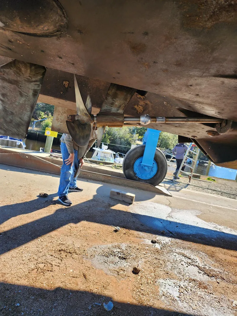 Slide: The Image of Underneath view of a 2008 Meridian 341 Sedan boat on dry dock. - 41