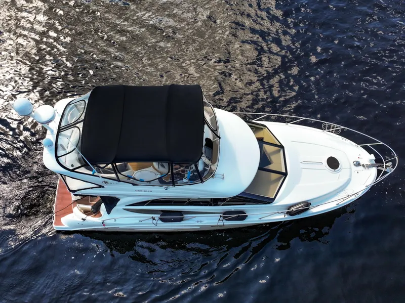Slide: The Image of 2008 Meridian 341 Sedan yacht cruising on open water, aerial view. - 7