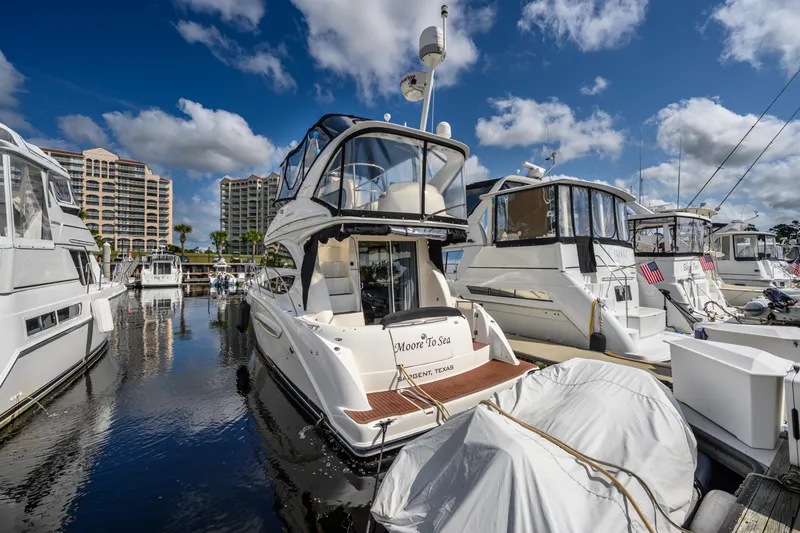 Slide: The Image of 2008 Meridian 341 Sedan yacht docked at marina under blue sky. - 9