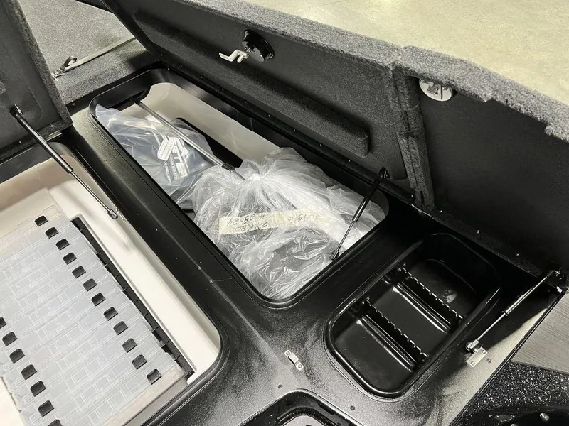 Slide: The Image of 2025 Skeeter ZXR20 boat storage compartments with organized gear and accessories. - 13