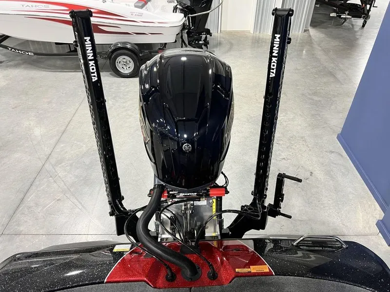 Slide: The Image of 2025 Skeeter ZXR20 boat with Minn Kota trolling motor in a showroom. - 27
