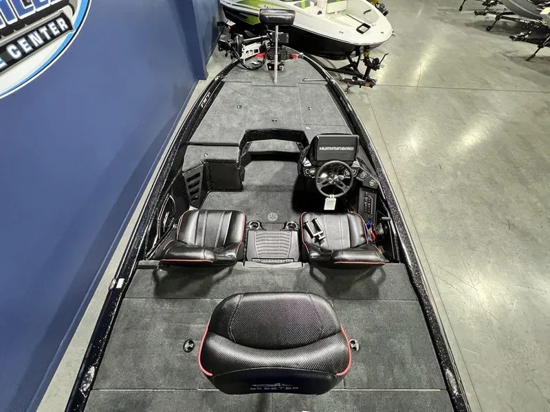 Slide: The Image of 2025 Skeeter ZXR20 boat interior with seating and steering console. - 28