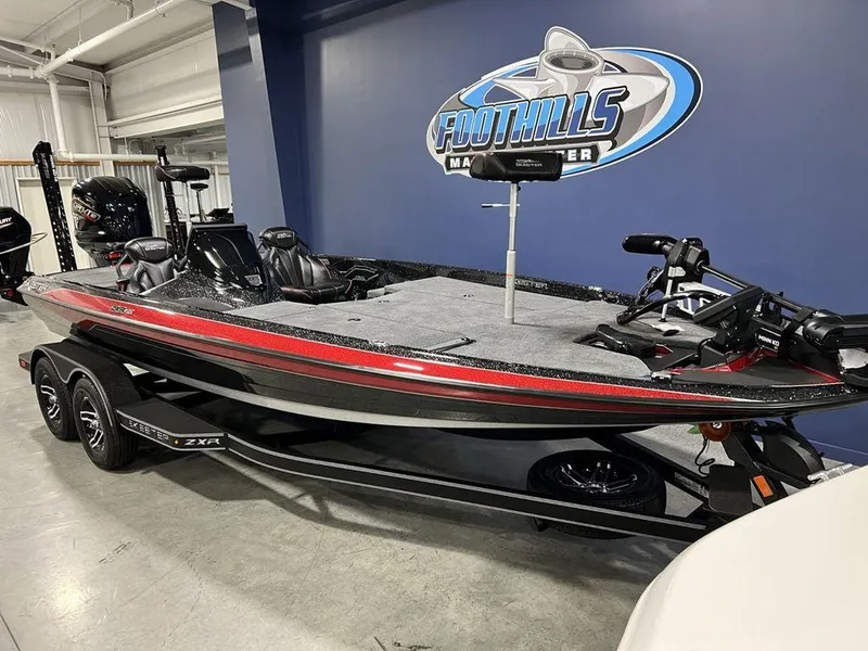 Slide: The Image of 2025 Skeeter ZXR20 bass boat with red accents displayed indoors at Foothills Marine. - 4
