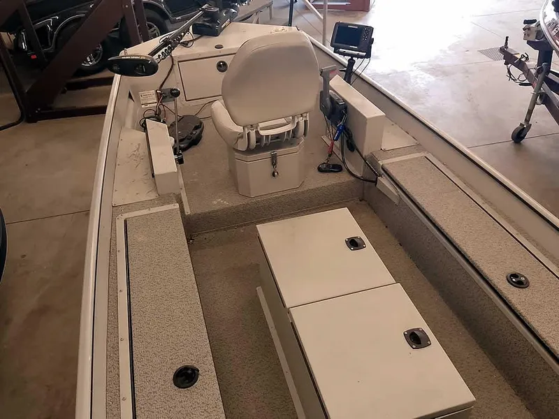 Slide: The Image of 2024 SeaArk 1652 Crappie boat interior with seating and storage compartments. - 15