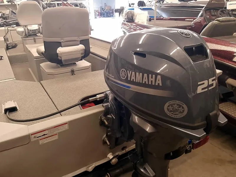 Slide: The Image of 2024 SeaArk 1652 Crappie boat with Yamaha 25HP outboard motor in showroom. - 2