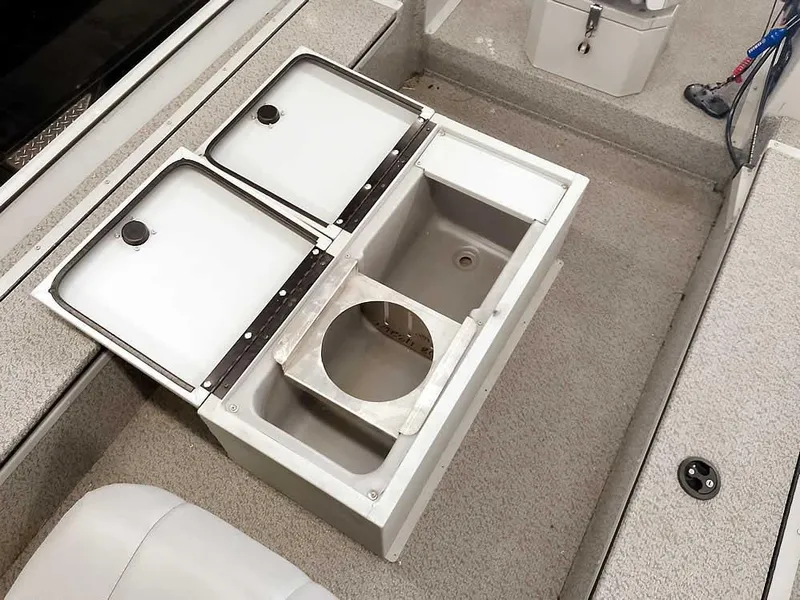 Slide: The Image of 2024 SeaArk 1652 Crappie boat interior with storage compartments and seating. - 20