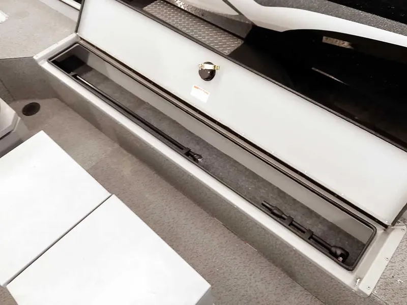 Slide: The Image of 2024 SeaArk 1652 Crappie boat storage compartment, open and empty, showcasing interior space. - 21