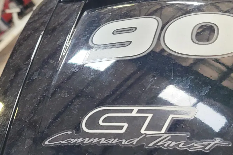 Slide: The Image of Close-up of a 2022 Godfrey Sweetwater SW2086 boat engine with "90 GT Command Thrust" text. - 10