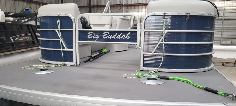 Slide: The Image of 2022 Godfrey Sweetwater SW2086 pontoon boat in storage, featuring "Big Buddah" nameplate. - 2