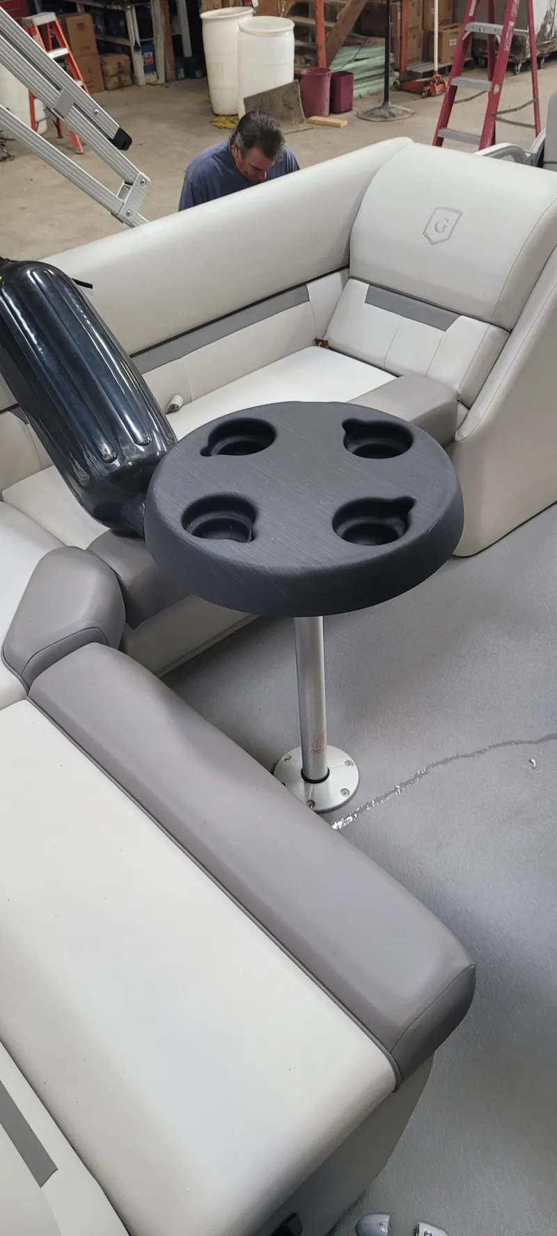 Slide: The Image of 2022 Godfrey Sweetwater SW2086 boat interior with cup holder table and seating. - 3