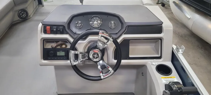 Slide: The Image of 2022 Godfrey Sweetwater SW2086 boat dashboard with steering wheel and control panel. - 4