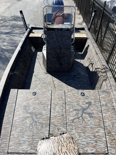 Slide: The Image of 2025 Xpress H210B boat with camouflage design and central console. - 5