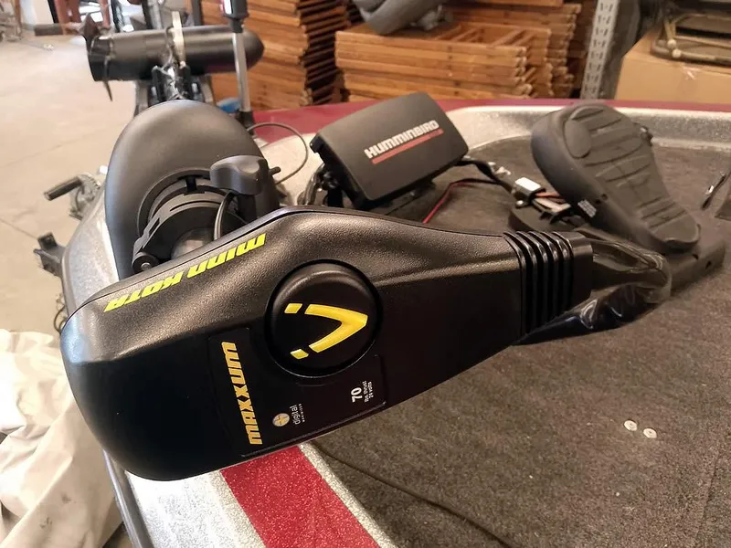 Slide: The Image of Minn Kota Maxxum trolling motor on a 1999 Champion 171 boat, with Humminbird electronics. - 7