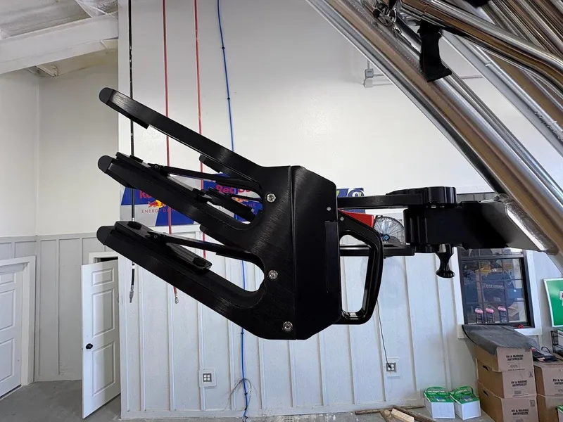 Slide: The Image of Wakeboard rack on 2025 MasterCraft NXT23 boat, mounted in a garage setting. - 20